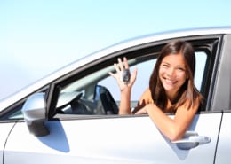 17 year old woman smiling showing new car keys