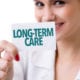 a doctor holding a long term care written on a little page
