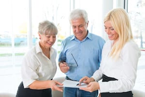 Elderly couple purchasing life insurance