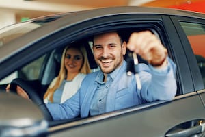 Young couple getting new non-owner car insurance for their new car