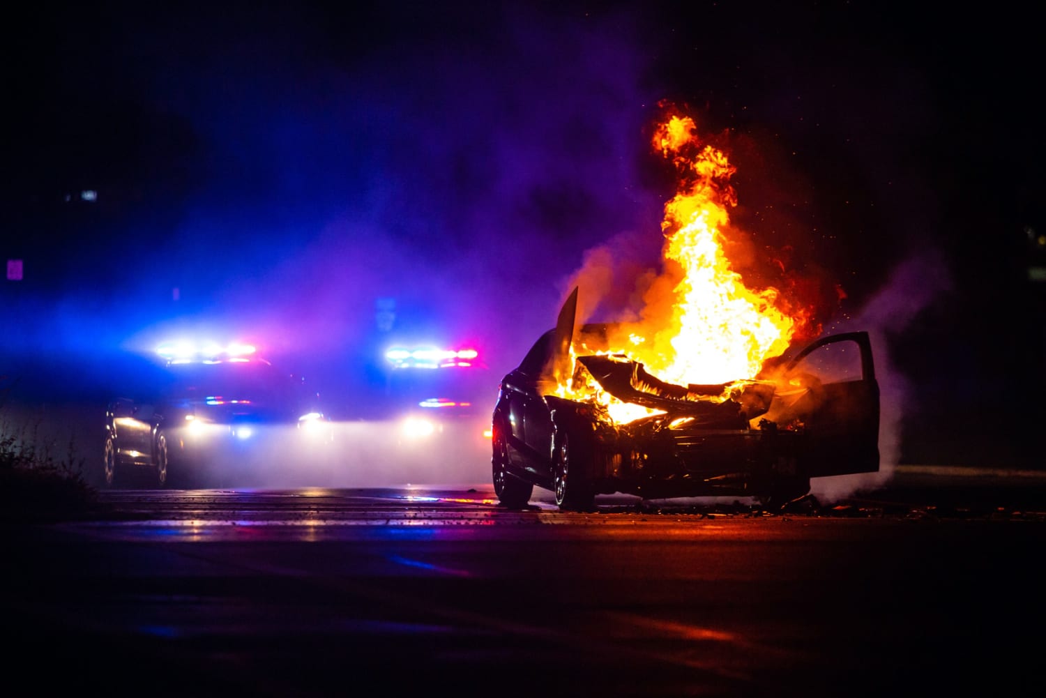 car on fire at night