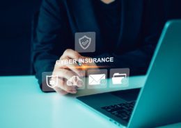 human typing cyber insurance and wondering how cyber insurance is becoming essential