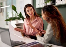 women are discussing how to lower small business insurance costs