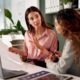 women are discussing how to lower small business insurance costs