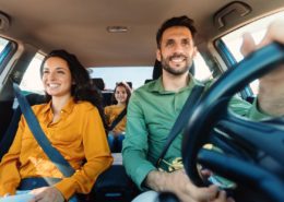 family driving and wondering why auto insurance costs keep climbing