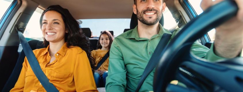 a family driving in their car