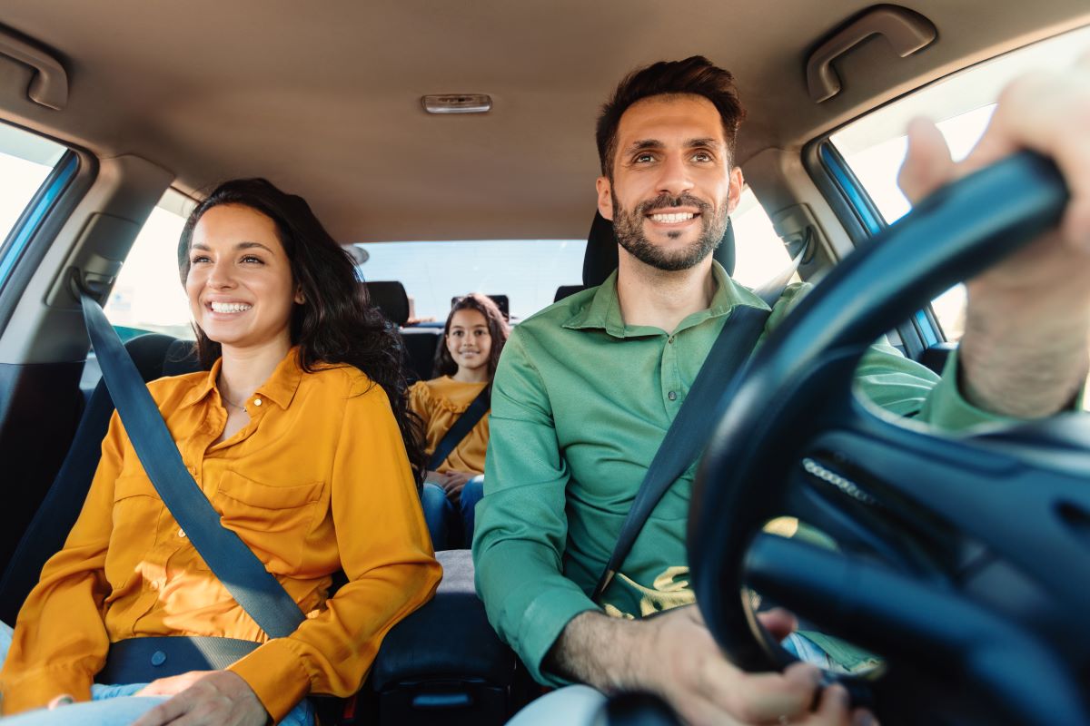 family driving and wondering why auto insurance costs keep climbing